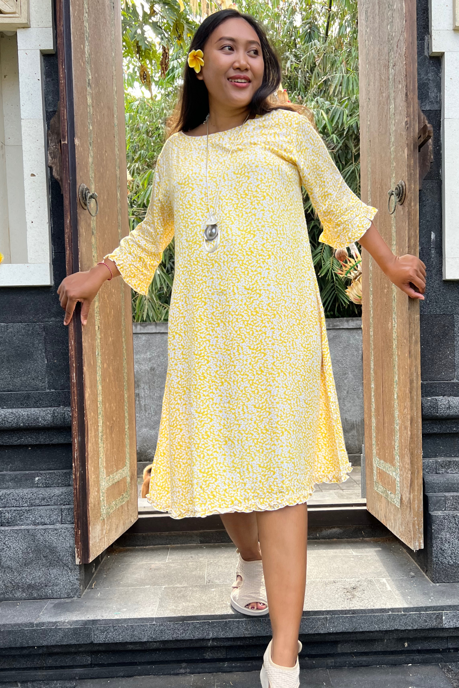 KitaKu model showing the latest rayon lemon printed dress with a mid length sleeve and round neckline